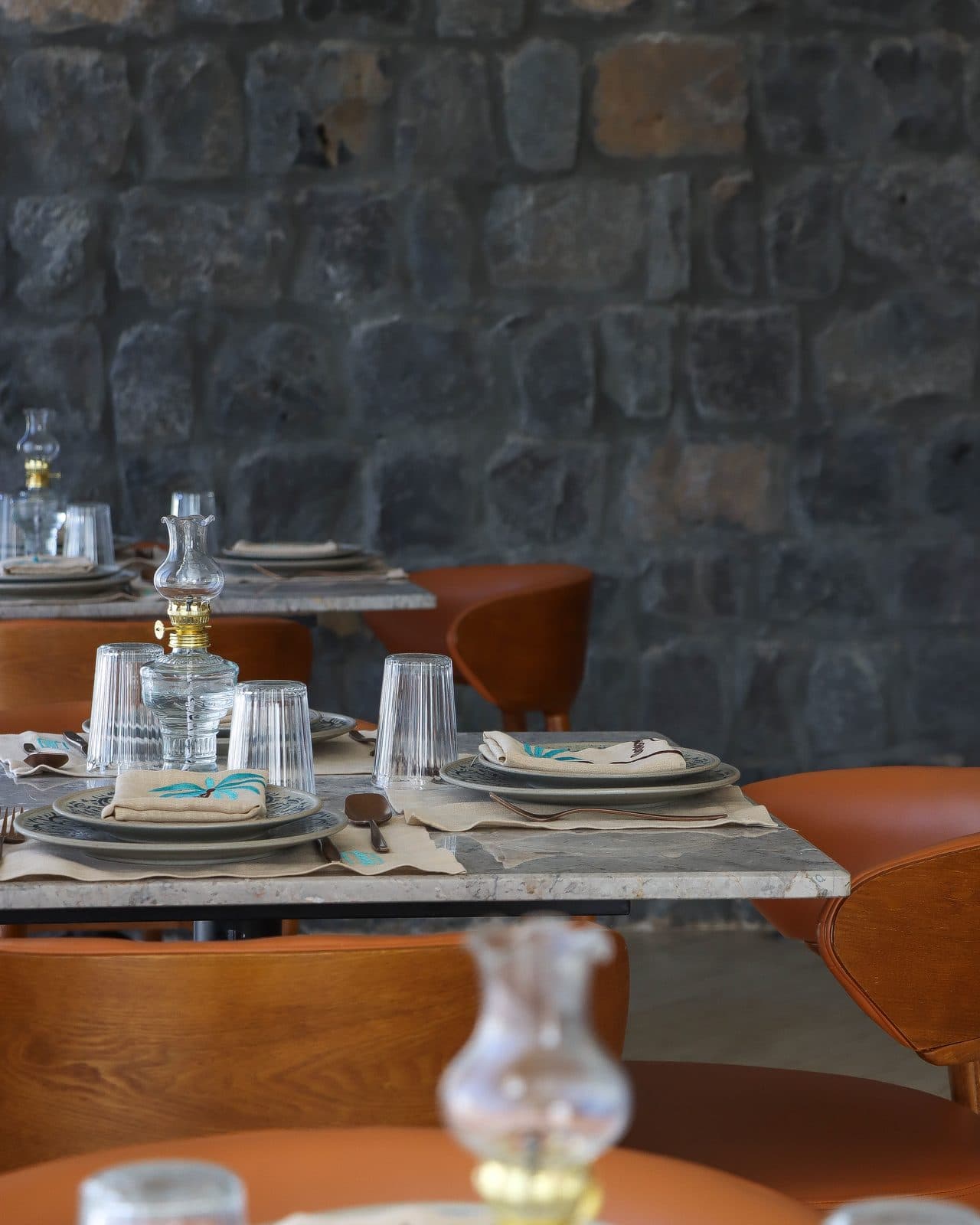 A table set against the bare stone wall
